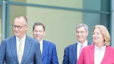 Union und SPD verteidigen ihr Reformpaket.  (Foto: Michael Kappeler/dpa)