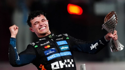Am Ziel seiner Träume: Der neue Formel-1-Weltmeister Lando Norris. (Foto: David Davies/PA Wire/dpa)
