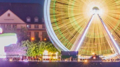 Fahrgeschäfte leuxhten beim Stadtfest Johannisnacht am Rherinufer vor der Christuskirche. (Foto: Andreas Arnold/dpa)