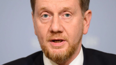 Die Länder seien sich einig in ihrer Forderung nach Ersatz ihrer Kosten, sagt der Vorsitzende der Ministerpräsidentenkonferenz, Michael Kretschmer. (Archivbild) (Foto: Robert Michael/dpa)