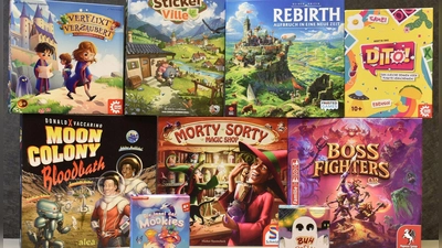 Die nominierten Spiele der Auszeichnungen „Spiel des Jahres“, „Kennerspiel des Jahres“ und „Kinderspiel des Jahres“ für das Jahr 2026 (undatierte Aufnahme). (Foto: -/Spiel des Jahres e.V./dpa)